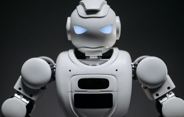Detailed studio shot of a modern robotic toy with a dark background, showcasing technological design.