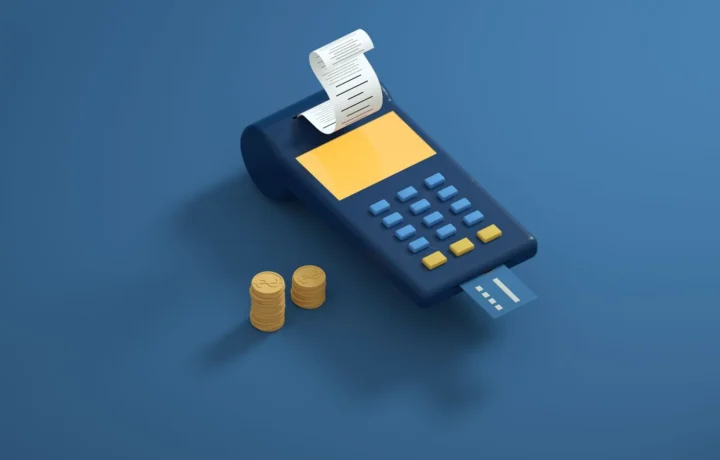 Terminal de pagamento azul com recibo e moedas douradas em fundo azul, representando a diferença subadquirente adquirente